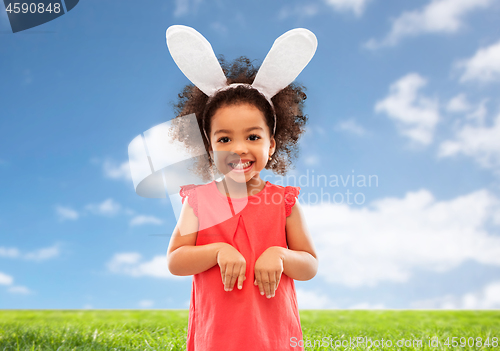 Image of happy little girl wearing easter bunny ears