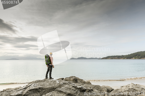 Image of Man exploring the coast