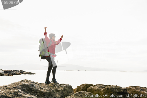 Image of Woman exploring the coast