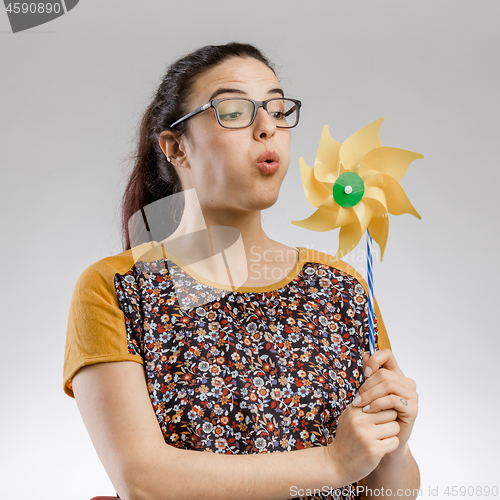 Image of Blowing a windmill