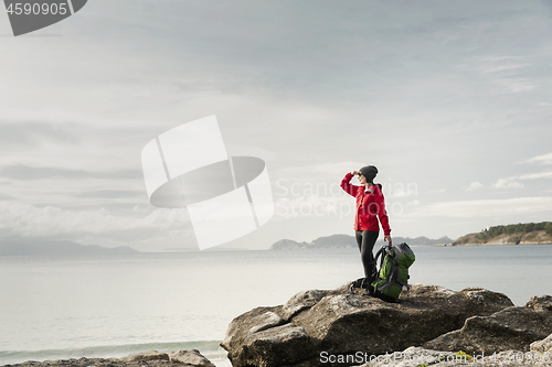 Image of Woman exploring the coast