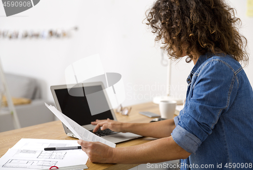 Image of Woman working at the office