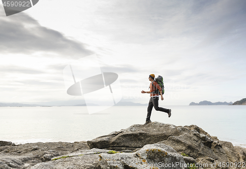 Image of Man exploring the coast