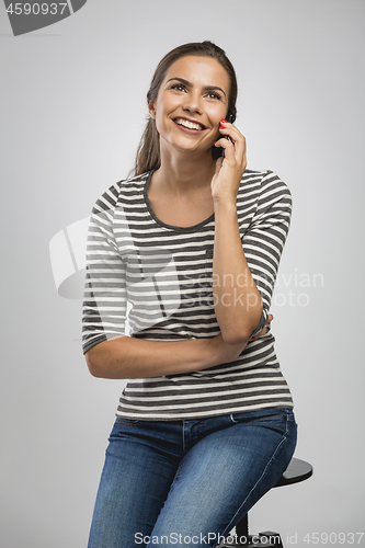 Image of Beautiful woman talking on phone