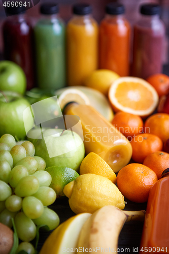 Image of Colorful bottles filled with fresh fruit and vegetable juice or smoothie