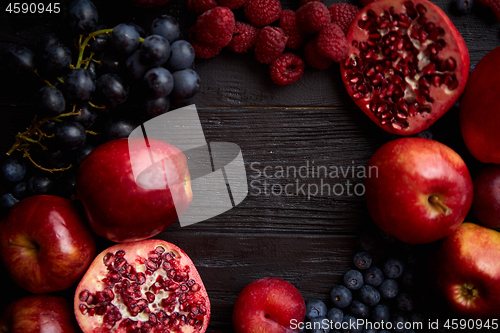 Image of Mix of fresh red and black fruits. With botteled fresh juices