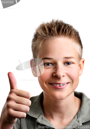 Image of Young boy with his thumbs up with joy