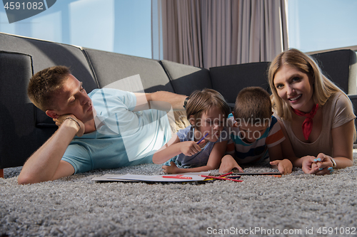 Image of young couple spending time with kids