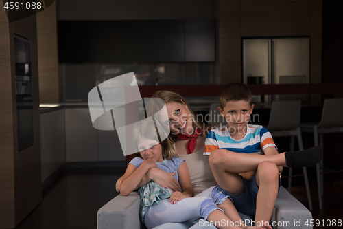 Image of young mother spending time with kids
