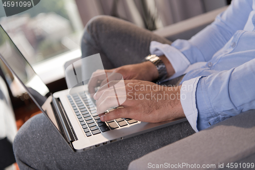 Image of man working from home