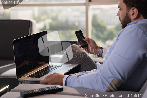 Image of man working from home