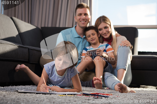 Image of young couple spending time with kids