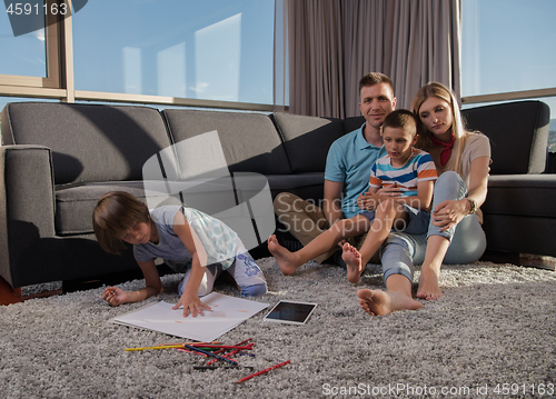 Image of young couple spending time with kids