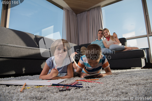 Image of young couple spending time with kids