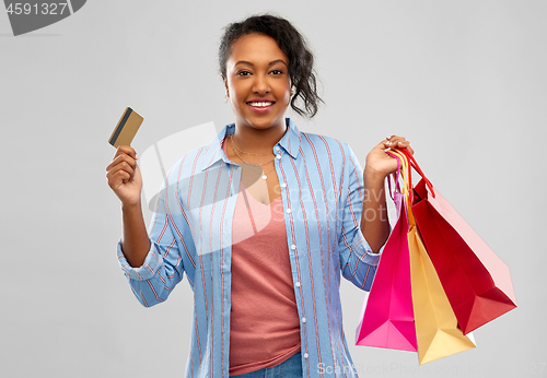 Image of african american woman shopping with credit card