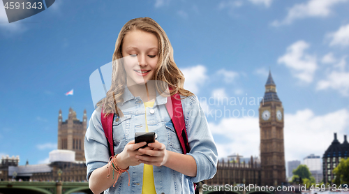 Image of teen student girl with school bag and smartphone