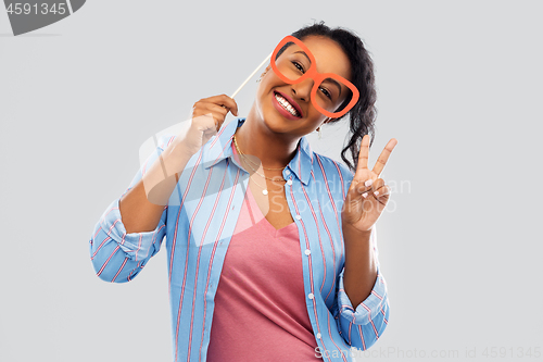 Image of happy african american woman with big glasses