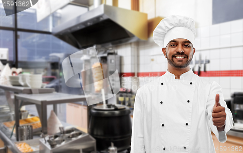 Image of happy indian chef showing thumbs up at kebab shop