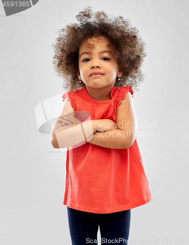 Image of displeased little african american girl over grey