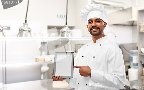 Image of indian chef with tablet pc at restaurant kitchen