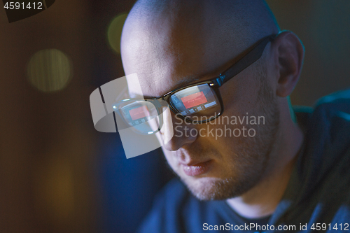 Image of hacker with access denied reflecting in glasses