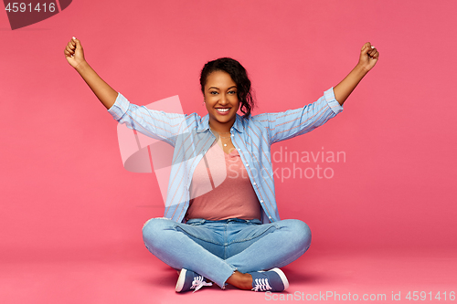 Image of happy african american woman celebrating success