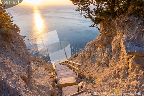 Image of Landscape, a staircase from the mountain descends to the sea