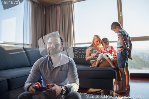 Image of Happy family playing a video game