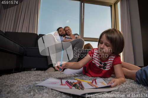 Image of young couple spending time with kids