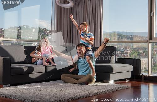 Image of Happy family playing a video game