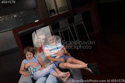 Image of young mother spending time with kids