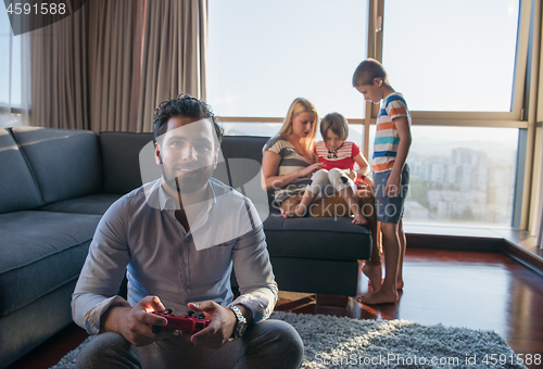 Image of Happy family playing a video game