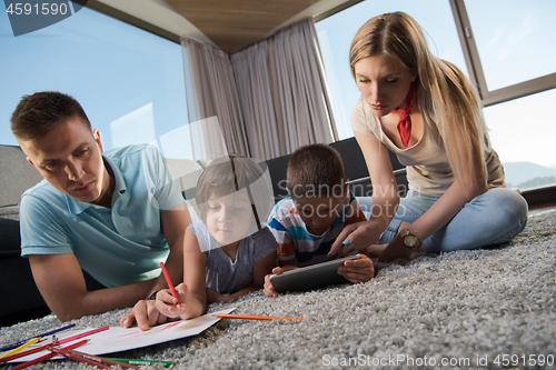 Image of young couple spending time with kids