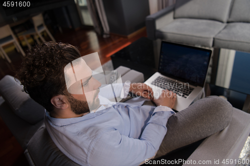 Image of man working from home