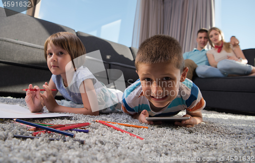 Image of young couple spending time with kids