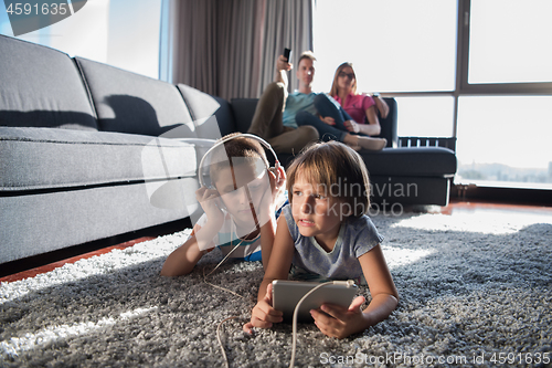 Image of couple spending time with kids