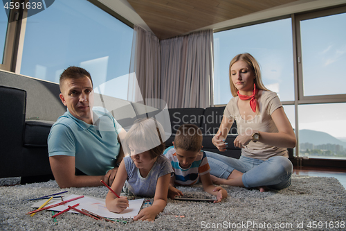 Image of young couple spending time with kids