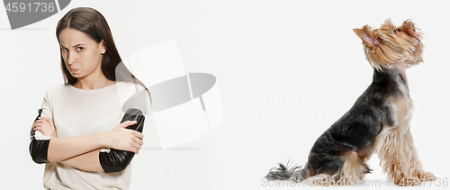 Image of Woman with her dog over white background