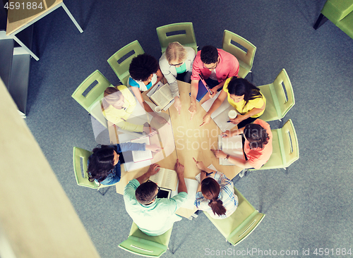 Image of group of international students pointing finger