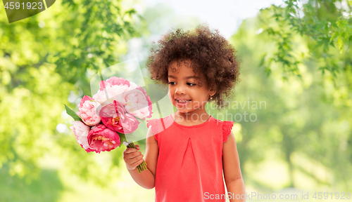 Image of happy little african american girl with flowers