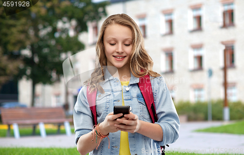 Image of teen student girl with school bag and smartphone