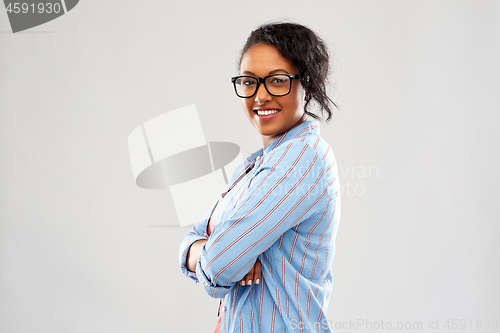 Image of confident african american woman with crossed arms