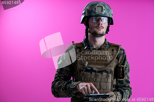 Image of soldier using tablet computer closeup