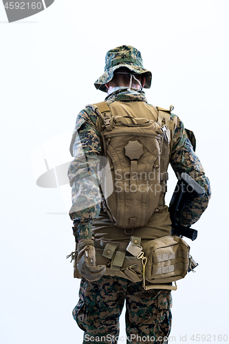 Image of soldier going in battle rear view