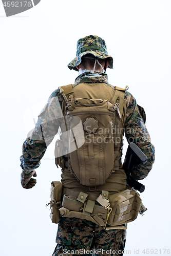 Image of soldier going in battle rear view