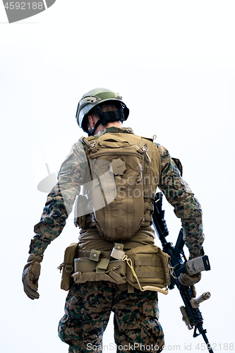 Image of soldier going in battle rear view