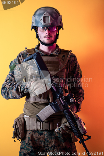 Image of modern soldier against yellow background