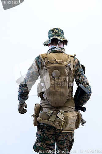 Image of soldier going in battle rear view