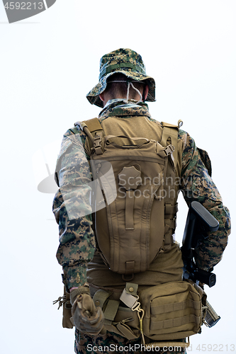 Image of soldier going in battle rear view