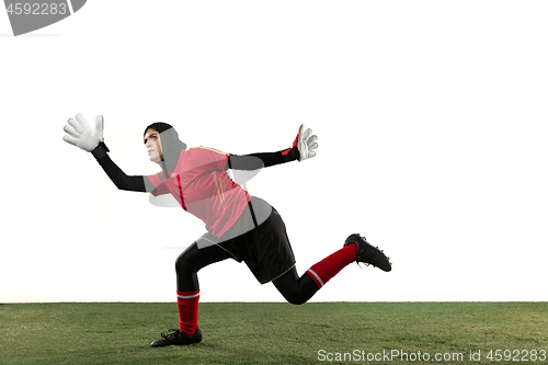 Image of Arabian female soccer or football player, goalkeeper on white studio background